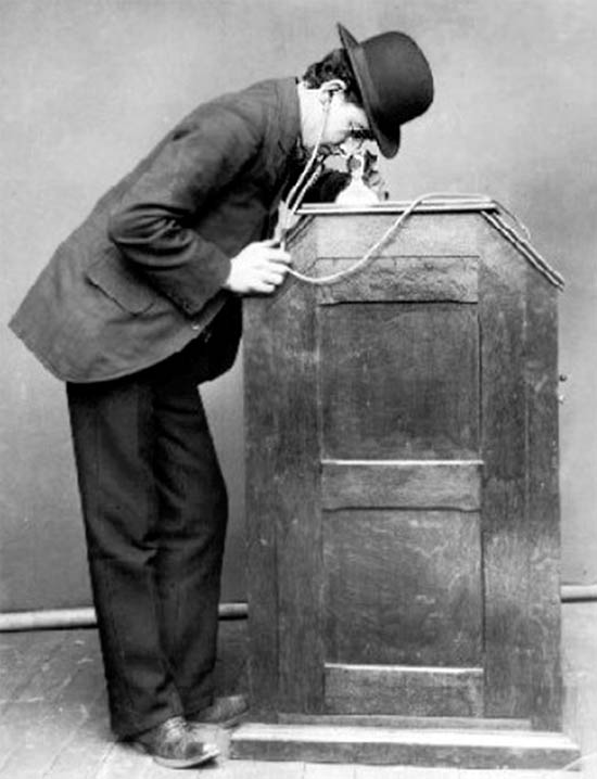 Edison's Kinetophone in which patrons listened through rubber ear tubes Edison's Kinetophone in which patrons listened through rubber ear tubes