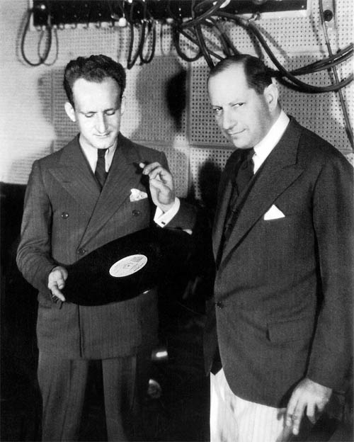 George Groves examines a Vitaphone disc with composer Sigmund Romberg George Groves examines a Vitaphone disc with composer Sigmund Romberg