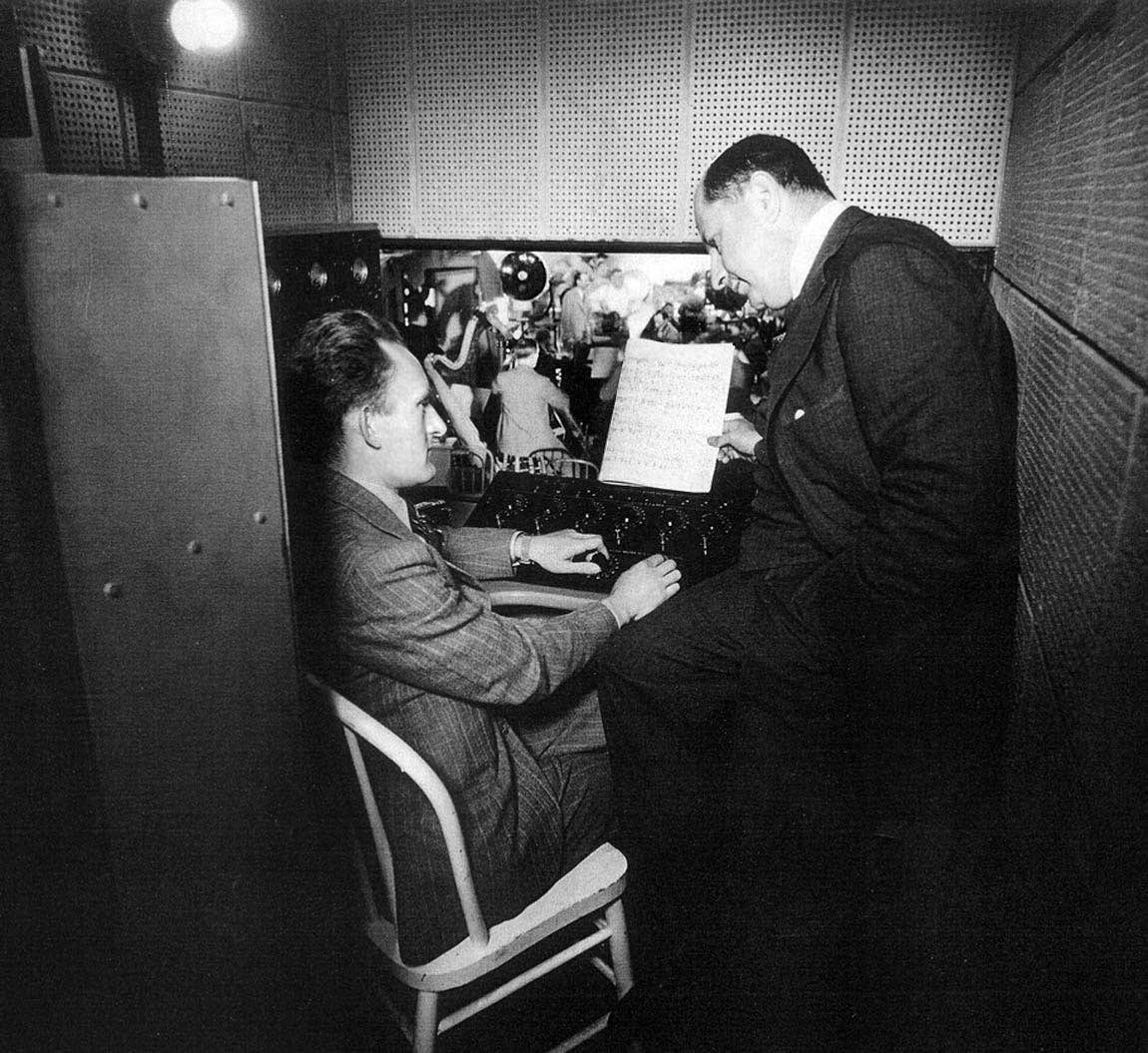 George Groves in a portable mixer booth with Sigmund Romberg George Groves in a portable mixer booth with Sigmund Romberg