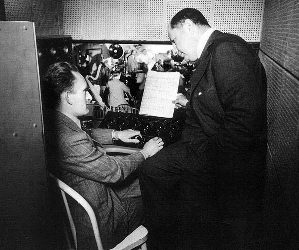George Groves in a portable mixer booth with Sigmund Romberg George Groves in a portable mixer booth with Sigmund Romberg