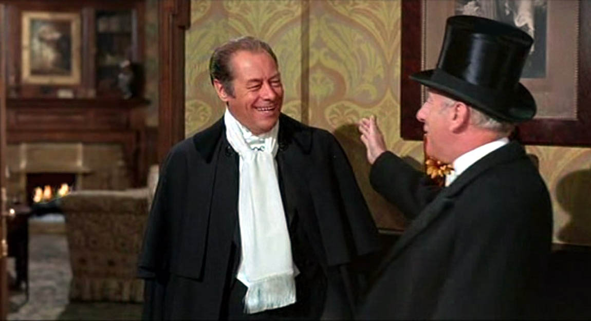 In this scene in My Fair Lady the radio microphone is concealed within Henry Higgins' scarf In this scene in My Fair Lady the radio microphone is concealed within Henry Higgins' scarf