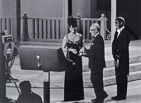 George Groves receiving a Best Sound Oscar from Claudia Cardinale and Steve McQueen at the 1965 Academy Awards George Groves receiving a Best Sound Oscar from Claudia Cardinale and Steve McQueen at the 1965 Academy Awards