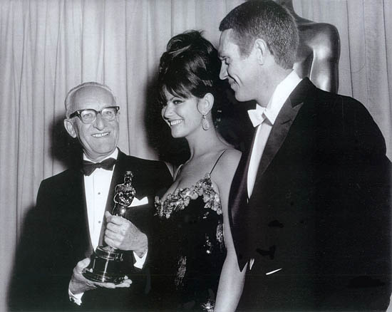 George Groves receiving his Best Sound Oscar for My Fair Lady from Claudia Cardinale and Steve McQueen George Groves receiving his Best Sound Oscar for My Fair Lady from Claudia Cardinale and Steve McQueen