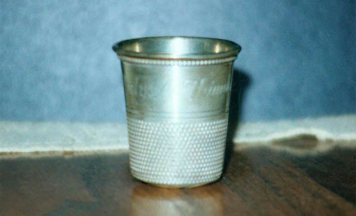 Spirit measure in the shape of a thimble that Rex Harrison presented to George Groves Spirit measure in the shape of a thimble that Rex Harrison presented to George Groves