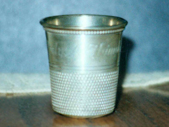 Spirit measure in the shape of a thimble that Rex Harrison presented to George Groves Spirit measure in the shape of a thimble that Rex Harrison presented to George Groves